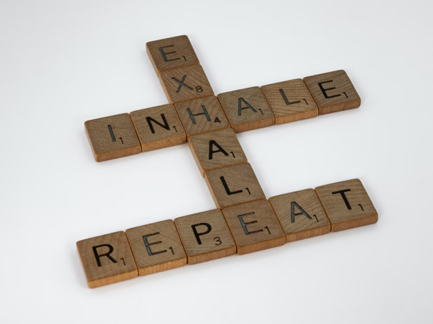 Picture of Scrabble™ letters that spell out the words Inhale, Exhale, and Repeat.